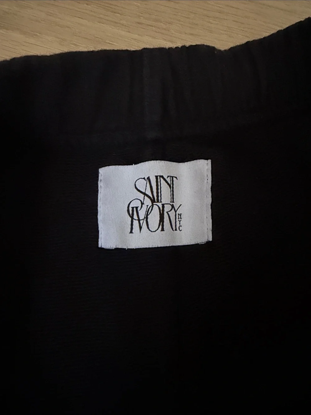 Black Athletic Shorts with Red 'S' Graphic